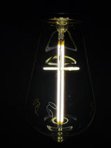 Edison-style LED bulb with an illuminated cross-shaped filament, Base Up orientation